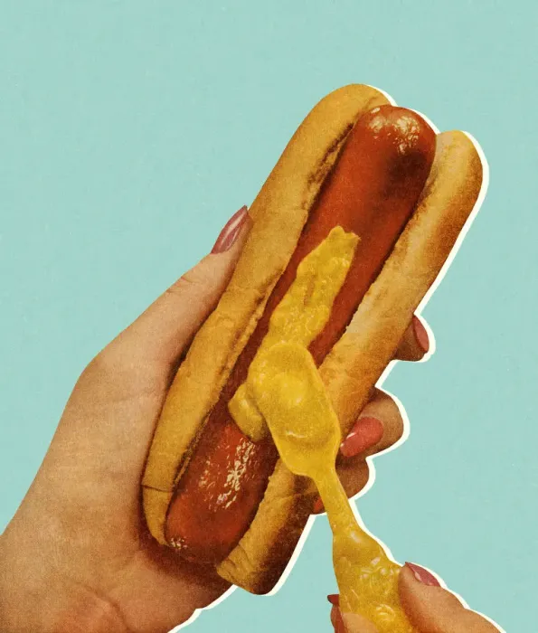 Framed Print : Spreading Mustard on a Hot Dog Framed Print : Spreading Mustard on a Hot Dog