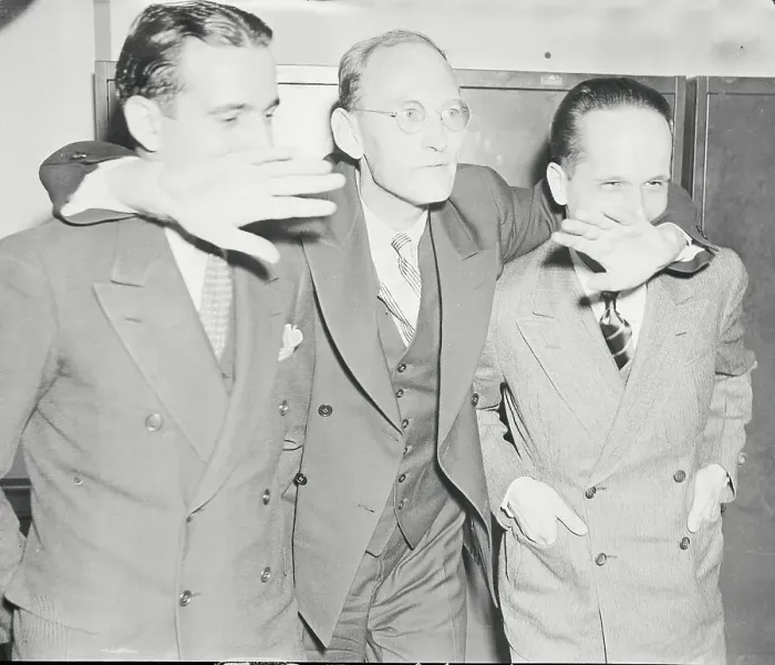 Framed Print : Spy Suspects Embracing at Courthouse Framed Print : Spy Suspects Embracing at Courthouse