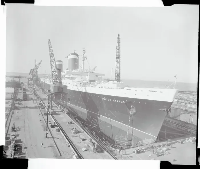 Framed Print : The S.S. United States Sitting at a Building Dock Framed Print : The S.S. United States Sitting at a Building Dock
