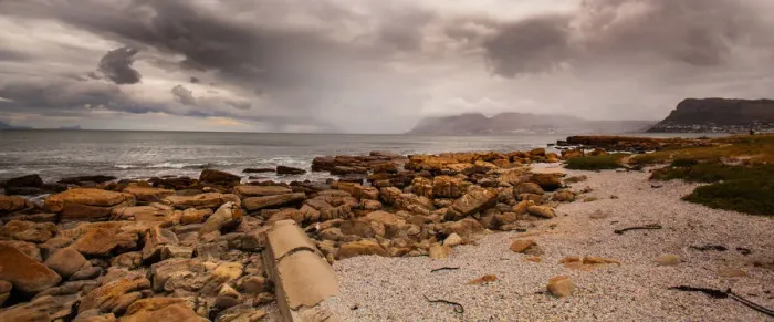 Framed Print : St James is a suburb of Cape Town, South Africa, situated on the False Bay coast between Muizenberg and Kalk Bay. The suburb is situated between the rocky shore and a steep mountain, and measures abou