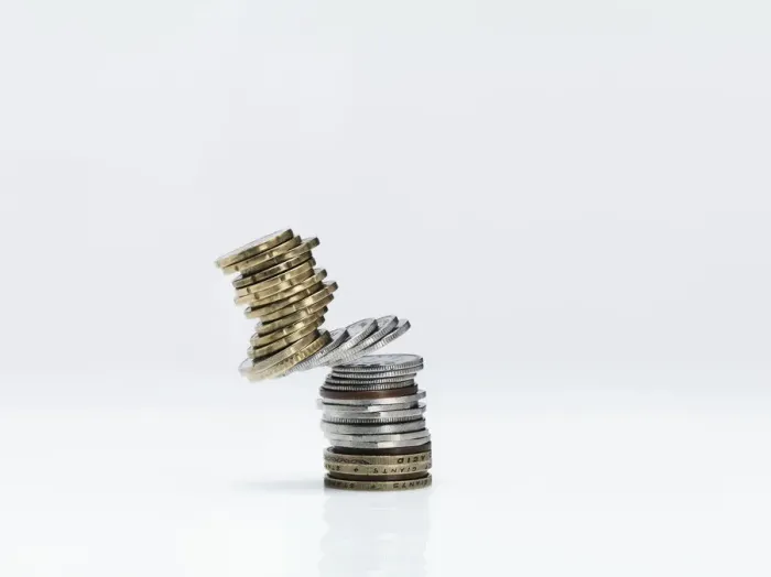 Framed Print : Stacked coins falling Framed Print : Stacked coins falling