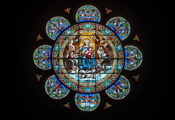 Stained Glass Rose Window featuring the Virgin Mary and her son Jesus Christ in the