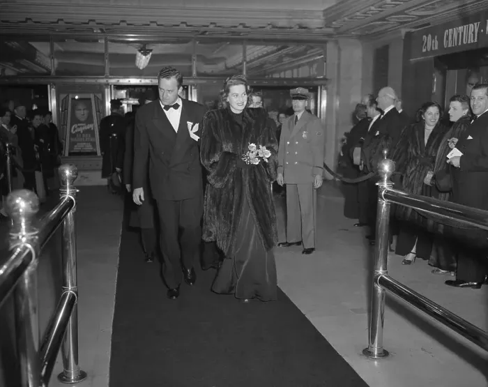 Framed Print : Star and Escort Enter Theatre for Premiere Framed Print : Star and Escort Enter Theatre for Premiere