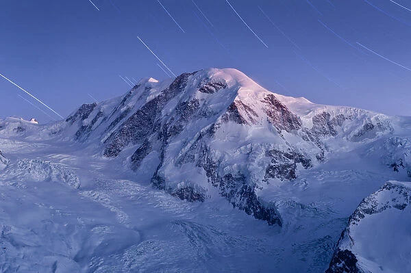 star trail over snow mountain