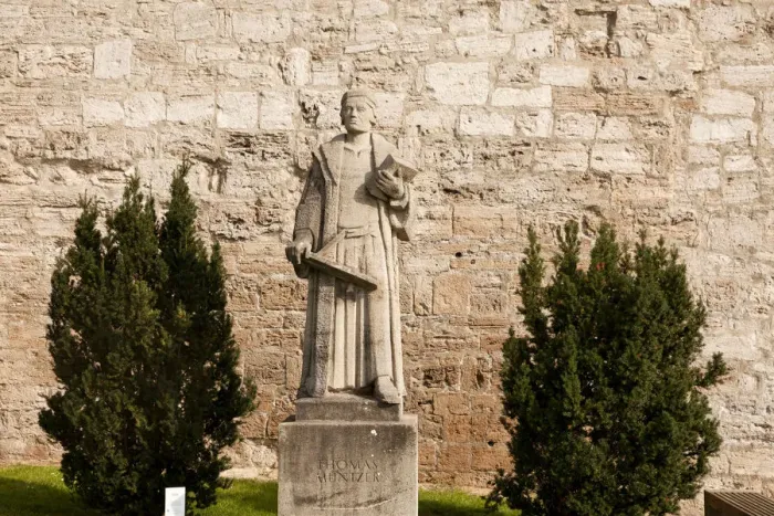 Framed Print : Statue of the preacher Thomas Muntzer in front of the city walls of Muhlhausen, Unstrut Hainich district, Thuringia, Germany Framed Print : Statue of the preacher Thomas Muntzer in front of the city walls of Muhlhausen, Unstrut Hainich district, Thuringia, Germany