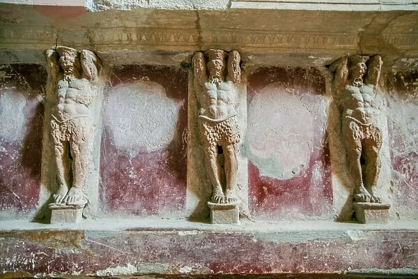 Statues of men carved into a wall, Pompeii