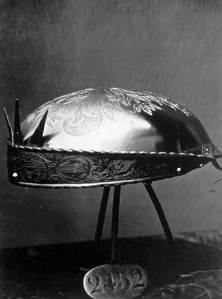 Steel Cap. A steel cap belonging to King Charles V displayed in the Royal Armoury, Madrid
