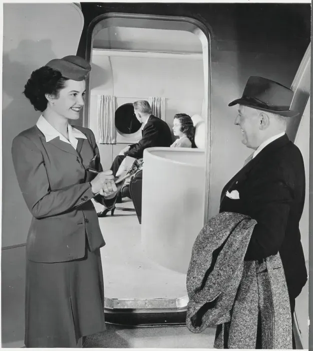Framed Print : Stewardess Checking in Passenger on Boeing Stratocruiser Framed Print : Stewardess Checking in Passenger on Boeing Stratocruiser