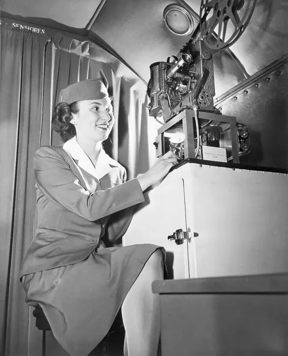 Framed Print : Stewardess Showing Talking Movie on Flight Framed Print : Stewardess Showing Talking Movie on Flight