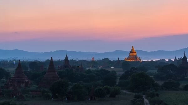 Stone pagoda orange lighting in Bagan pagoda field