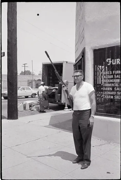 Framed Print : Store Owner with Rifle