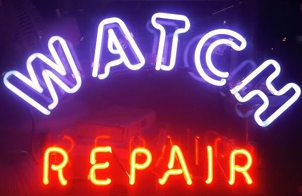 Store sign of watch repair shop in New York City, USA