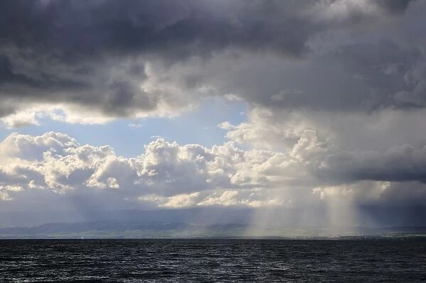 Storm clouds and sunbeams above Lake Geneva, Lac Leman, Evian-les-Bains, Haute-Savoie, Rhone-Alpes, France