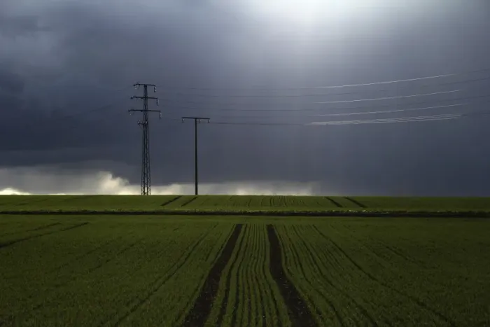Framed Print : Stormy sky over fields with electricity pylons, Biberach, Upper Swabia, Baden-Wuerttemberg, Germany