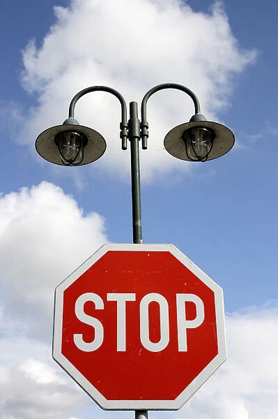 Street lamps and a stop sign