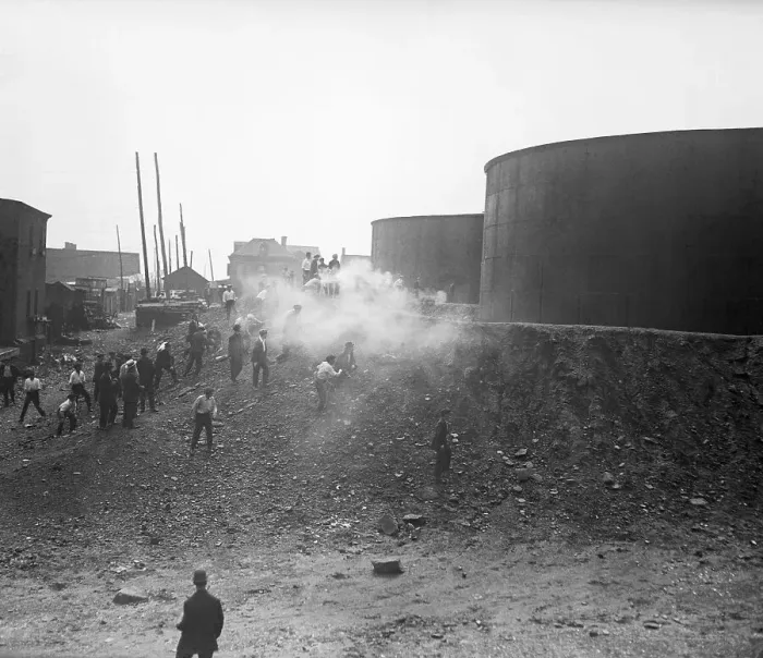 Framed Print : Strikers Behind Oil Tanks with Smoke from Guns Framed Print : Strikers Behind Oil Tanks with Smoke from Guns