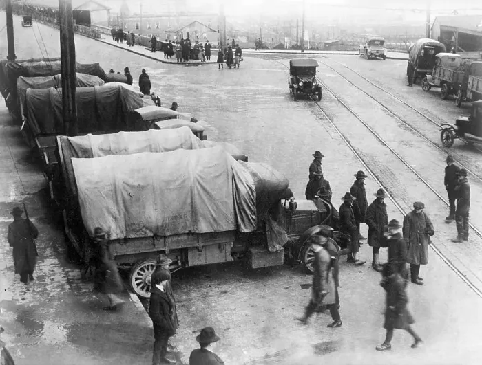 Framed Print : Striking Workers Walk by Covered Trucks Framed Print : Striking Workers Walk by Covered Trucks