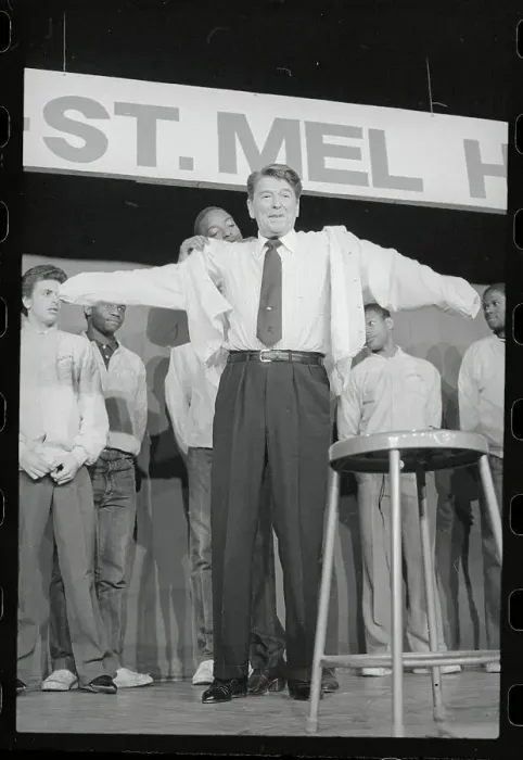 Framed Print : Student Helping Ronald Reagan with Jacket Framed Print : Student Helping Ronald Reagan with Jacket