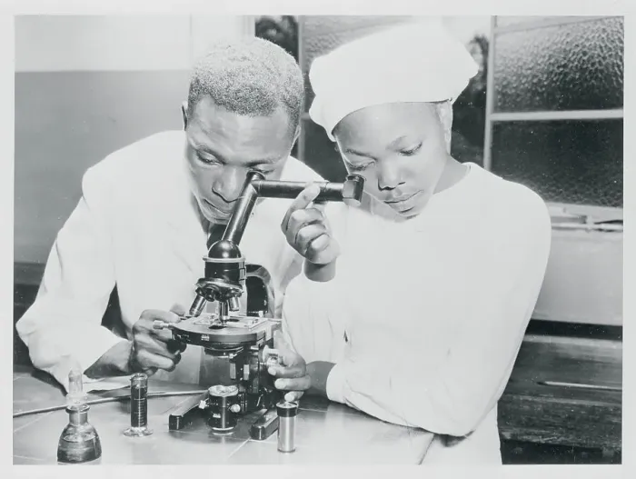 Framed Print : Student Learning How to Use a Microscope Framed Print : Student Learning How to Use a Microscope
