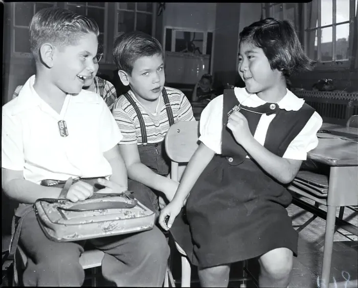 Framed Print : Student Shows Metal Tag To Classmates Framed Print : Student Shows Metal Tag To Classmates