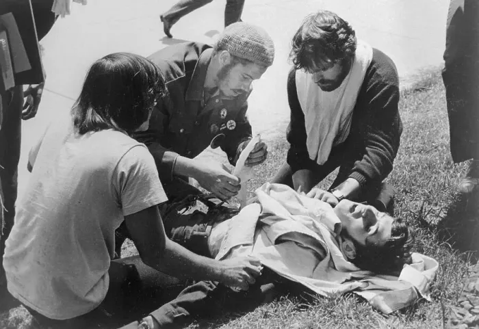 Framed Print : Students Giving First Aid to a Demonstrator