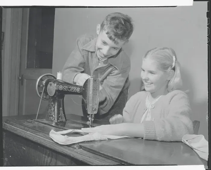 Framed Print : Students Practicing Sewing Framed Print : Students Practicing Sewing