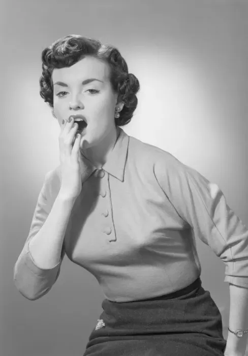Framed Print : Studio portrait of woman yawning Framed Print : Studio portrait of woman yawning