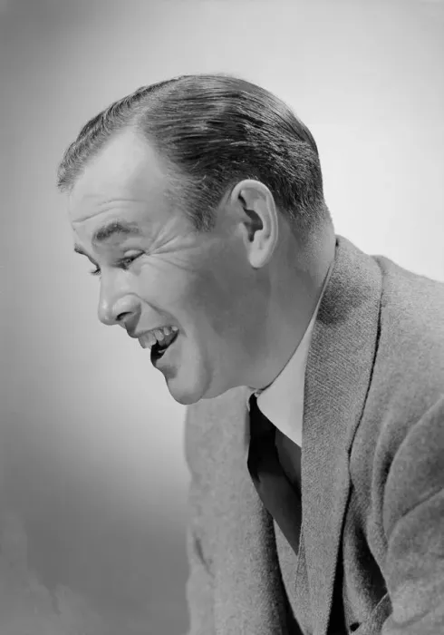 Framed Print : Studio shot of mid adult man laughing Framed Print : Studio shot of mid adult man laughing