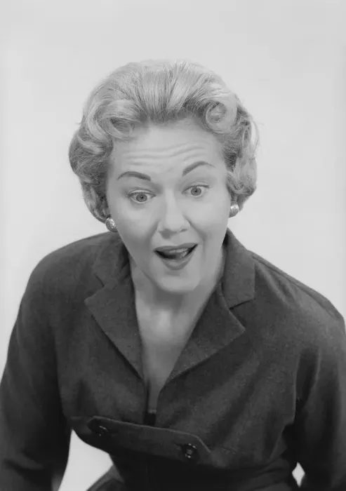 Framed Print : Studio shot of mid adult woman with facial expression