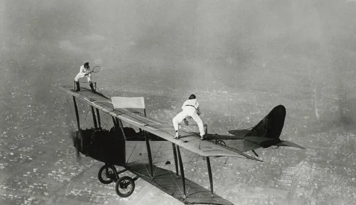 Framed Print : Stunt Flyers Performing on Wings of Airplane Framed Print : Stunt Flyers Performing on Wings of Airplane