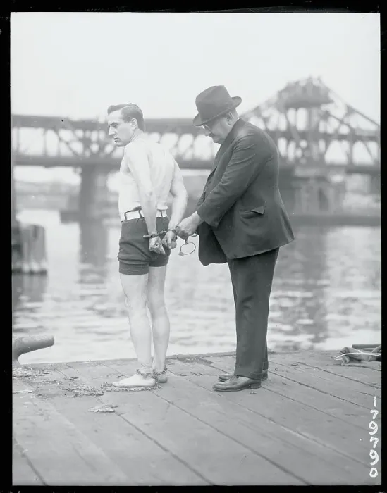 Framed Print : Stunt Man Being Handcuffed Framed Print : Stunt Man Being Handcuffed