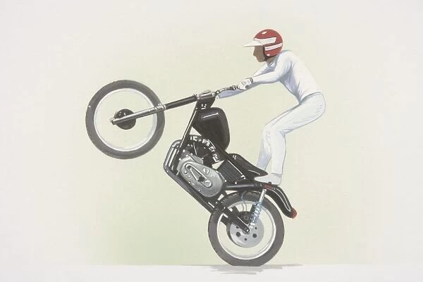 Stunt rider standing on motorbike, front wheel raised, side view