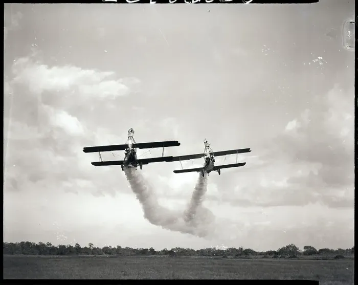 Framed Print : Stuntmen Ride Atop Wing of Plane