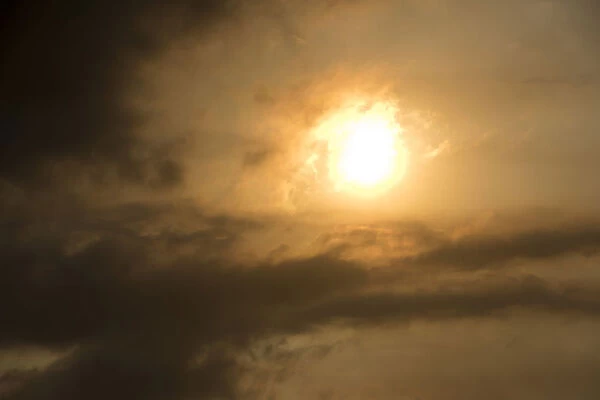 Sun behind clouds and brownish ash and gas clouds of the Holuhraun fissure eruption, north of the Baroarbunga volcano, highlands of Iceland, Northeastern Region, Iceland