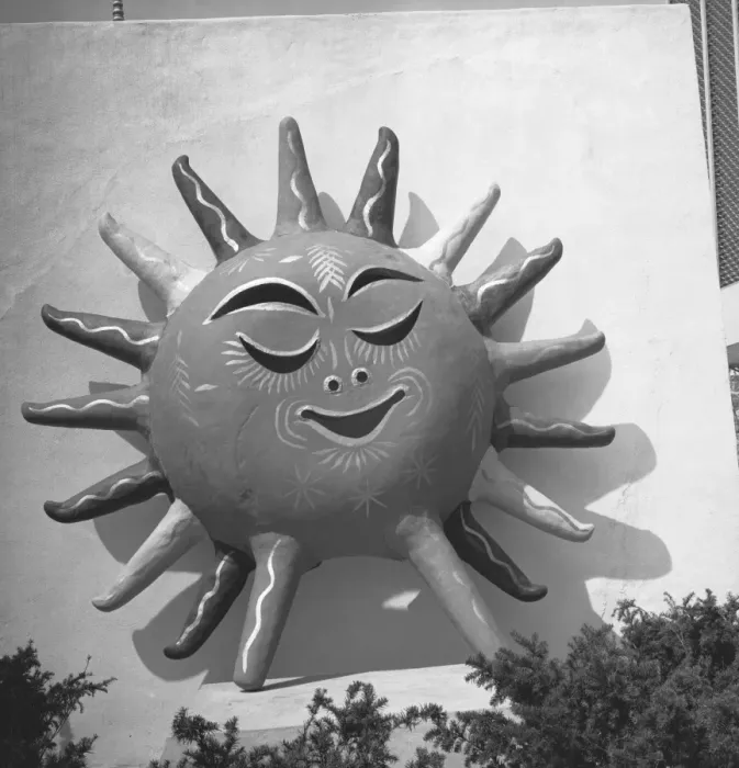 Framed Print : Sun with human face on building wall, (B&W) Framed Print : Sun with human face on building wall, (B&W)