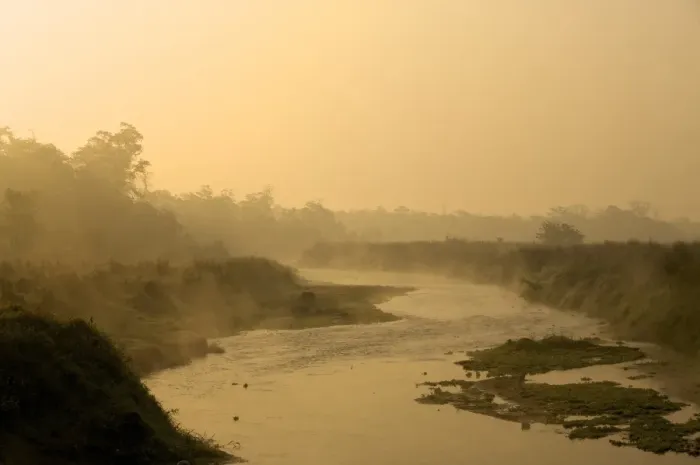 Framed Print : The sun rising over a small foggy river early in the morning, Chitwan National Park, Nepal, Asia