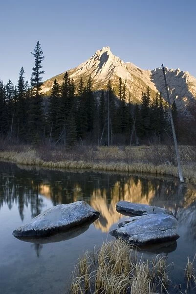 Sun shining on a mountain peak, Mount Lorette, Kananaskis, Alberta, Canada