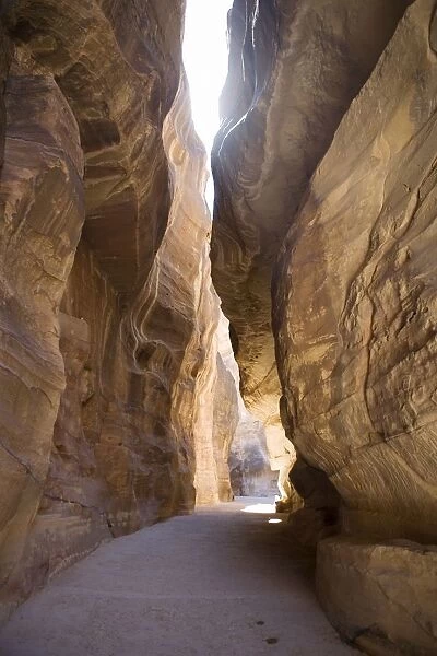 Sun Shining Between a Rock Crevice, Petra. UNESCO World Heritage Site. Jordan, Middle East