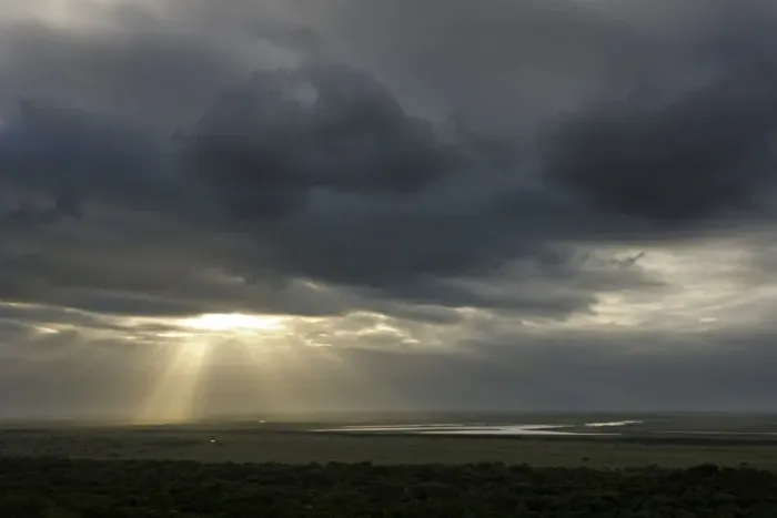 Framed Print : Sunbeams breaking through a dark cloudy over a wetland, iSimangaliso Wetland Park, Kwazulu-Natal, South Africa Framed Print : Sunbeams breaking through a dark cloudy over a wetland, iSimangaliso Wetland Park, Kwazulu-Natal, South Africa