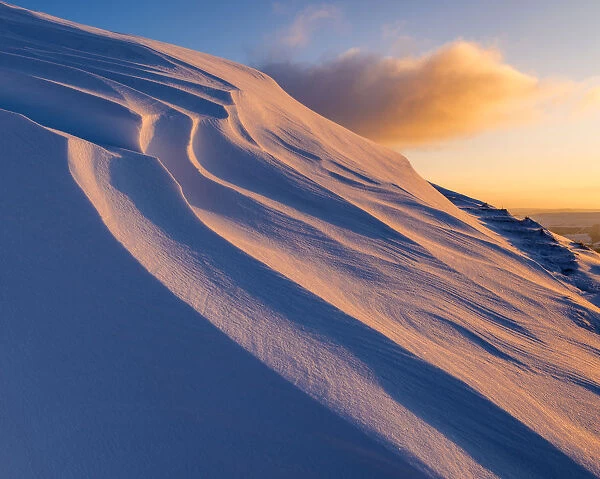 Sunrise light on snowdrifts, high up in the High Peak of Derbyshire