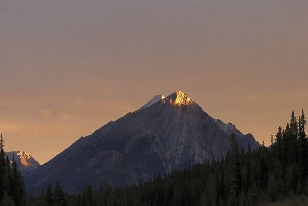 Sunrise Lights Up A Mountain Peak