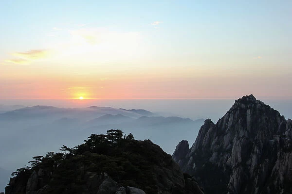 Sunrise above Mount Huangshan (Yellow Mountain or Mt. Huangshan), Anhui Province, China
