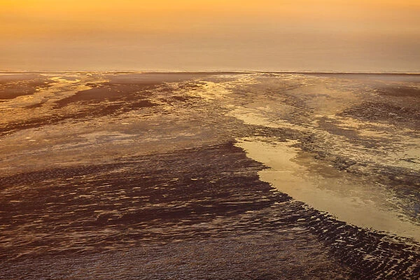 Sunset glow over snow covered sands, Iceland