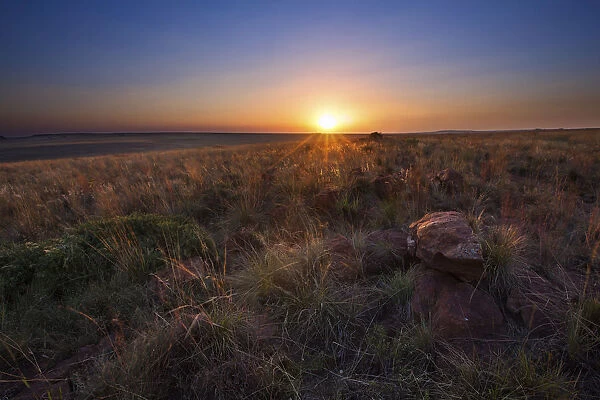 Sunset landscape of a rock against dramatic cloudy sky - Witbank South Africa