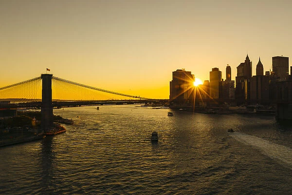 Sunset seen through Manhattan skyline, New York City, USA