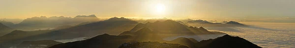 Sunset, view on the Jachenau with Walchensee and Zugspitze with Wetterstein range and from peaks of the Alpine foothills in fog, Benediktenwand, near Garmisch-Partenkirchen, Bavaria, Germany