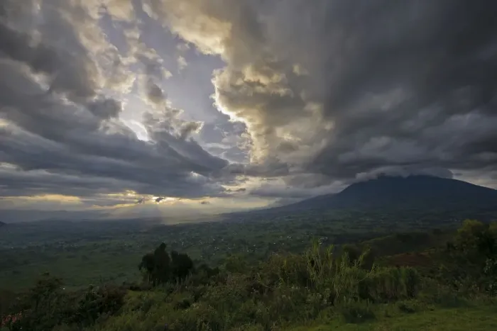 Framed Print : Sunset over the Virunga Mountains of the Volcanoes National Park in Rwanda with the rural settlements dotting the landscape Framed Print : Sunset over the Virunga Mountains of the Volcanoes National Park in Rwanda with the rural settlements dotting the landscape