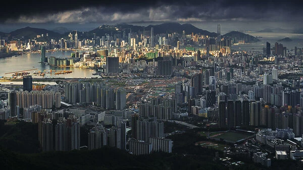 Sunshine over cloudy Hong Kong City
