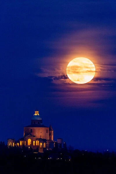 Full super moon rising over San Luca Sanctuary, Bologna, Italy