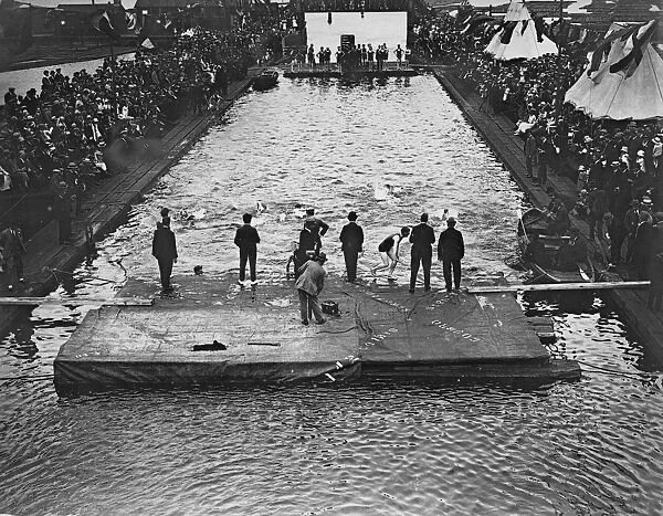 Swimming. July 1922: Crowds watching the swimming and diving at Surrey Docks, London 